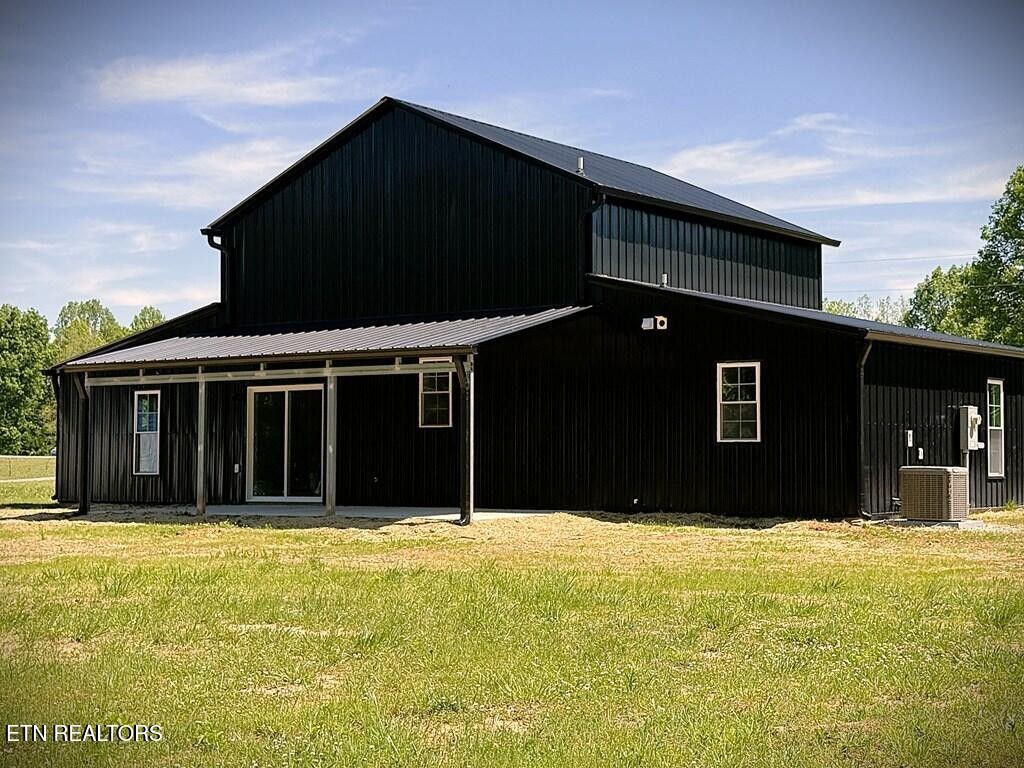 246 Ralph Spivey Lane Hilham, TN 38568 - Photo 6 of 53 a black house with front of it