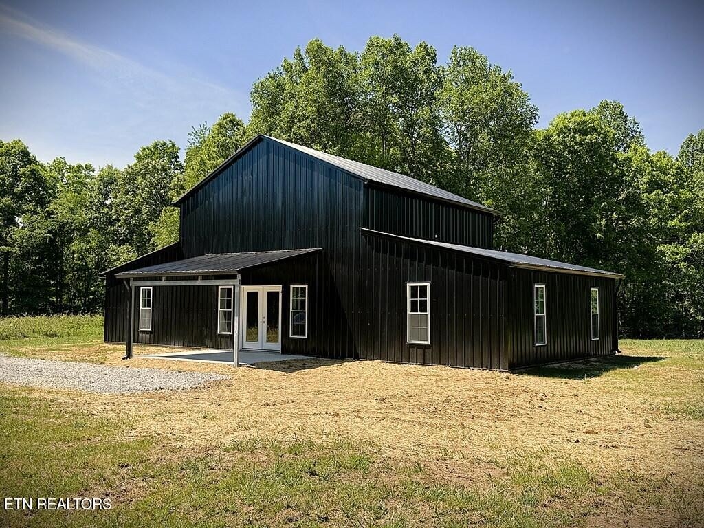 246 Ralph Spivey Lane Hilham, TN 38568 - Photo 7 of 53 a house with trees in the background