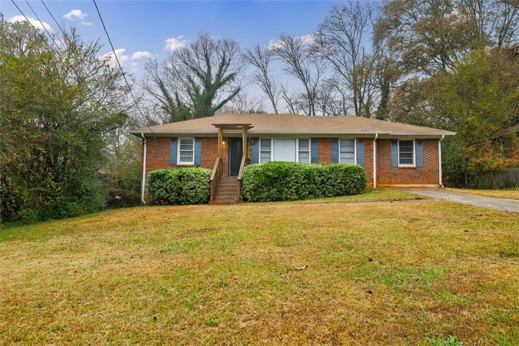 2238 Alpha Drive Decatur, GA 30032 - Photo 1 of 1 a front view of house with yard and trees around