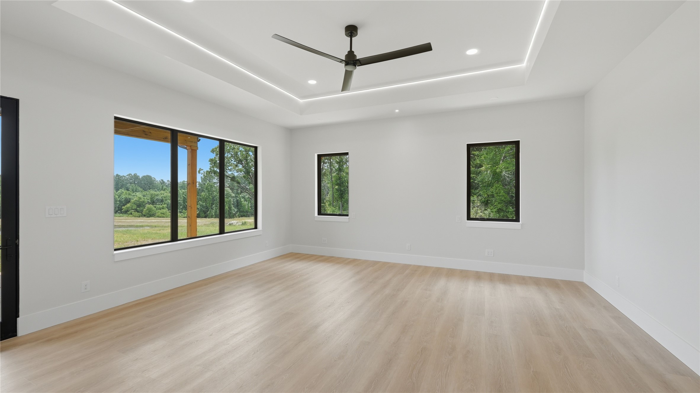 447 County Road 2211 Rusk, TX 75785 - Photo 37 of 50 wooden floor in an empty room with a window