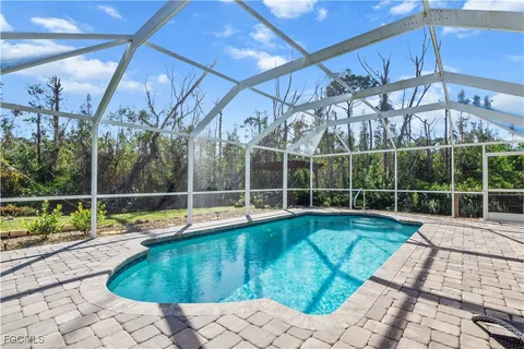 a view of a swimming pool with a patio