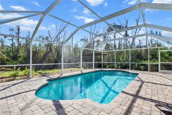 a view of a swimming pool with a patio