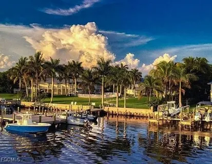 a view of a lake with couches and sky view