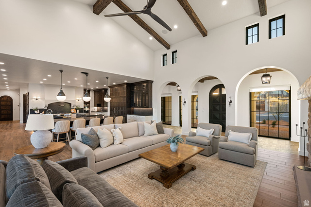 4871 South Homestead Way Washington, UT 84780 - Photo 17 of 151 Living room featuring arched walkways, hardwood / wood-style flooring, recessed lighting, ceiling fan, and lofted ceiling