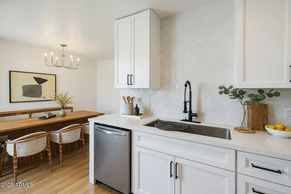 a kitchen with a sink and cabinets