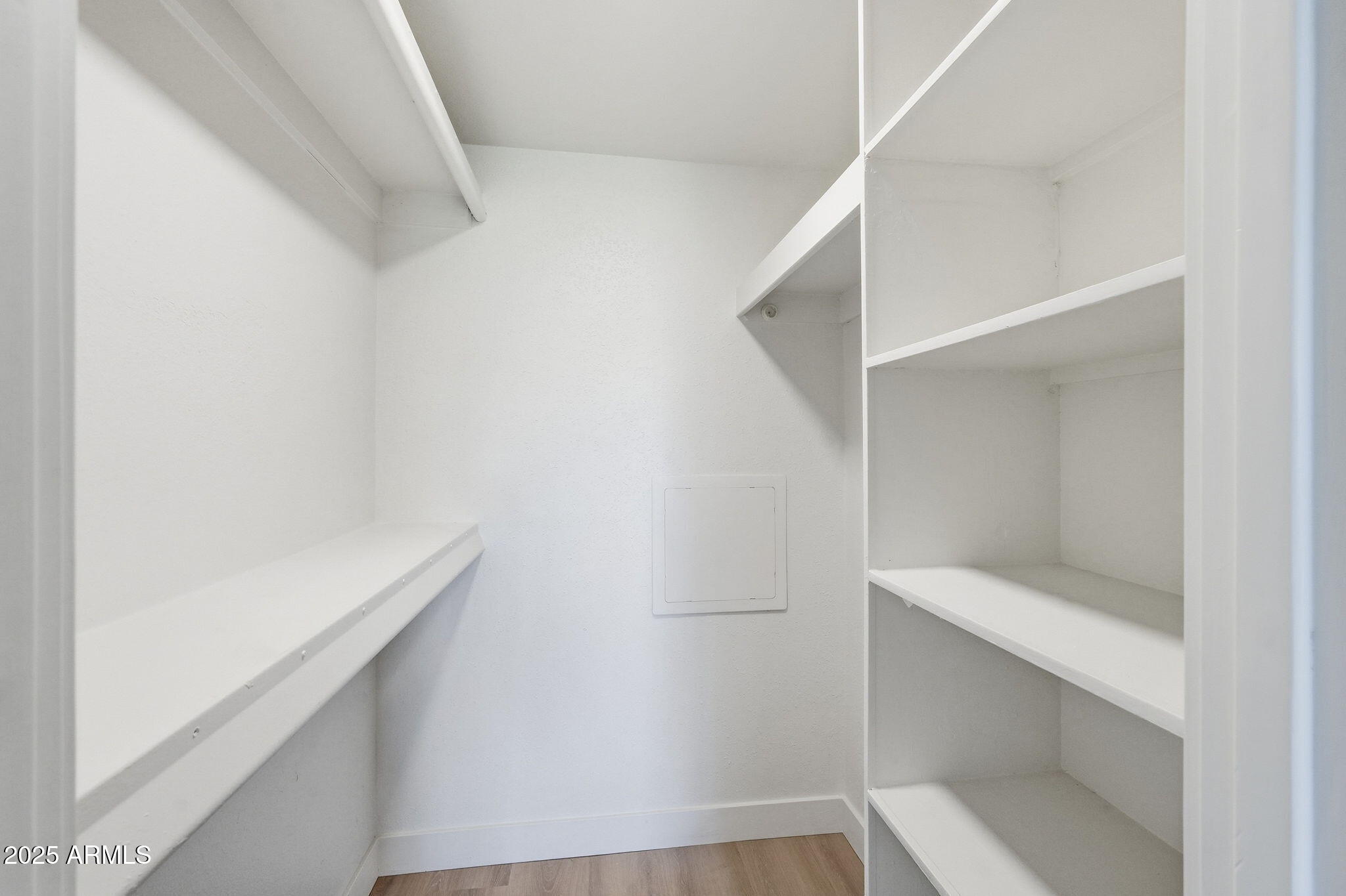 4201 East Camelback Road, Unit 74 Phoenix, AZ 85018 - Photo 11 of 20 a view of an empty walk in closet