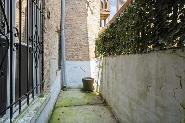 a view of a porch with a door and chair