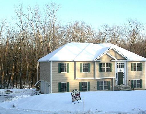 35 Aspen Way Brookfield, CT 06804 - Photo 1 of 1 a front view of a house with a yard and garage