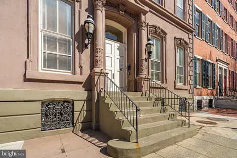 a view of a brick building with many windows