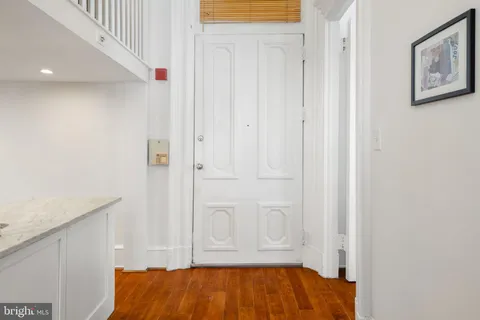 a kitchen with stainless steel appliances granite countertop a refrigerator and a stove