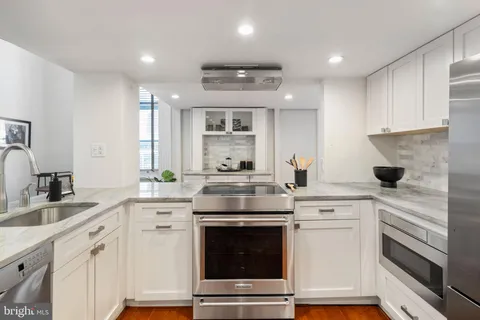 a view of a dining room with furniture and window