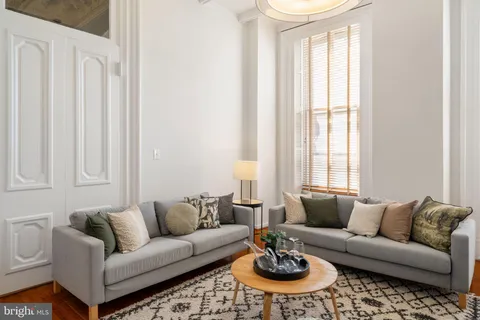 a bathroom with a double vanity sink mirror and shower