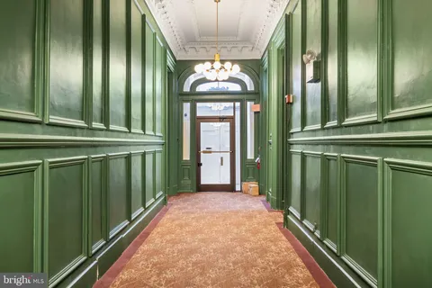 a view of a entryway door with wooden floor