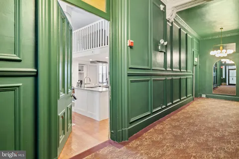 a view of living room with furniture and wooden floor