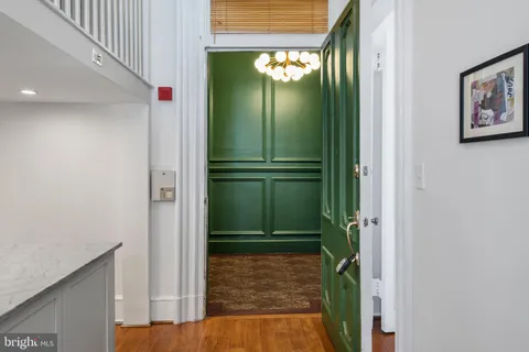 a kitchen with stainless steel appliances granite countertop a stove a refrigerator and a refrigerator