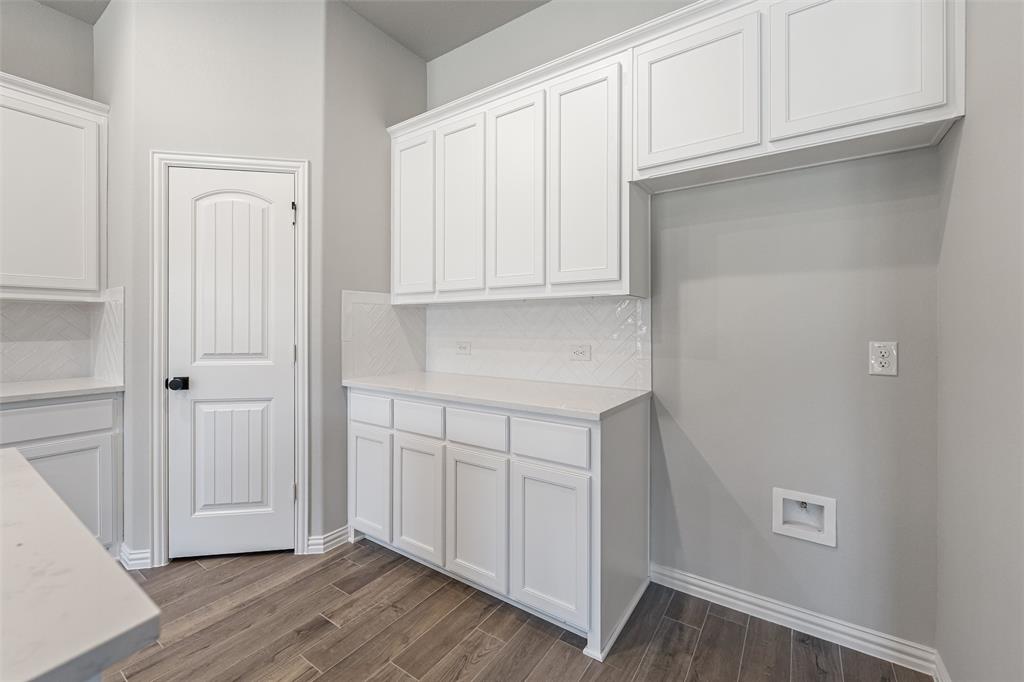 140 Oak Grv Way Springtown, TX 76082 - Photo 15 of 40 a view of cabinets with wooden floor