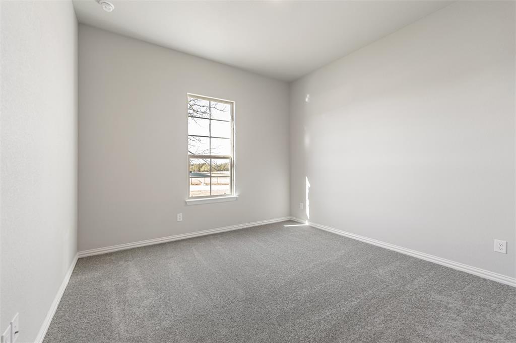 140 Oak Grv Way Springtown, TX 76082 - Photo 17 of 40 an empty room with windows