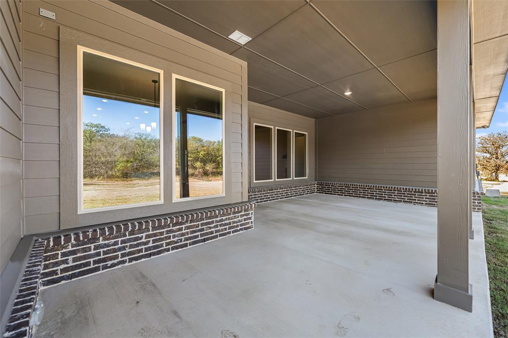 140 Oak Grv Way Springtown, TX 76082 - Photo 36 of 40 a view of an empty room with a window