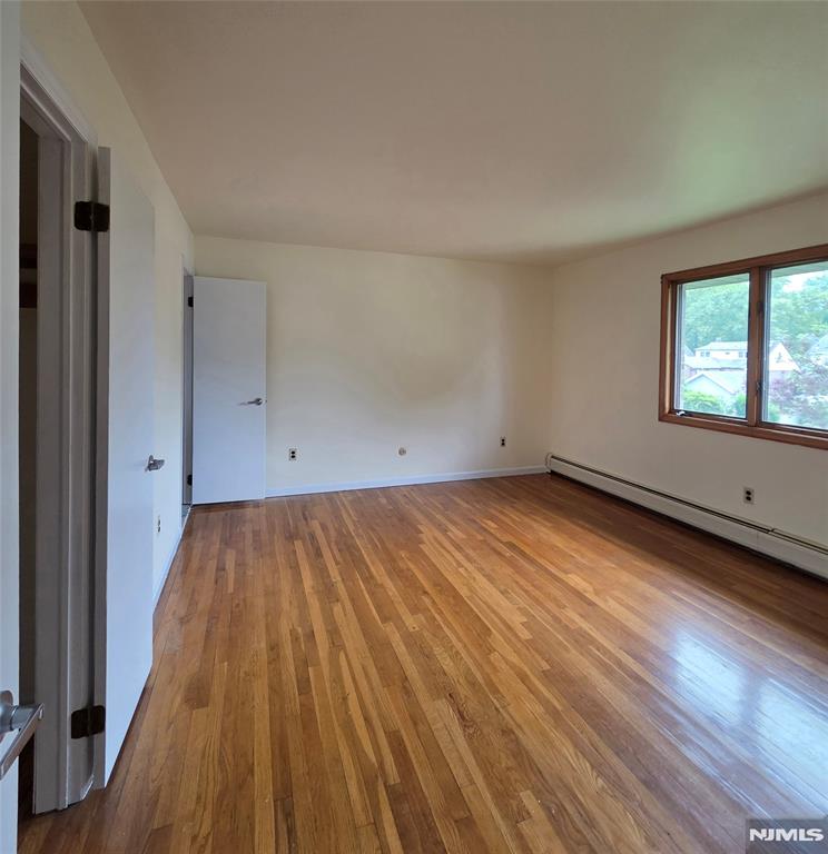 688 Day Avenue, Unit 2 Ridgefield, NJ 07657 - Photo 15 of 18 wooden floor in an empty room