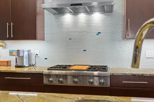 a bathroom with a sink a mirror and shower
