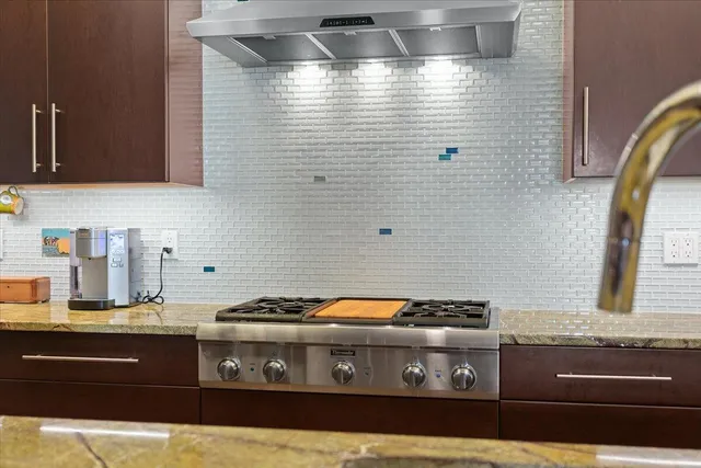 a bathroom with a sink a mirror and shower