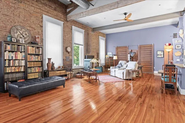 a kitchen with stainless steel appliances granite countertop a sink a stove and a refrigerator
