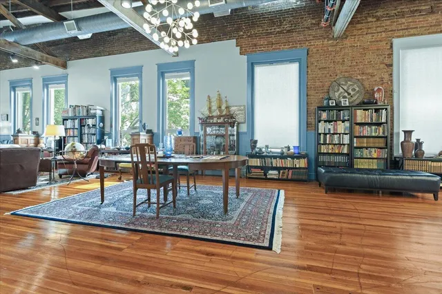 a room with furniture and wooden floor