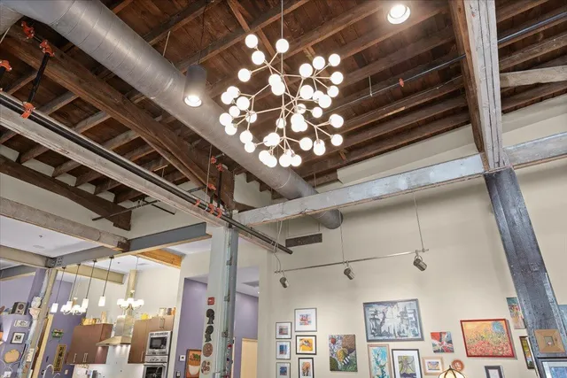 a bathroom with a sink a mirror and a shower