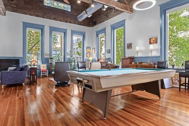 a bathroom with a granite countertop sink and a window