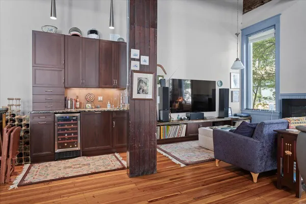 a kitchen with stainless steel appliances granite countertop a stove a sink dishwasher and a refrigerator