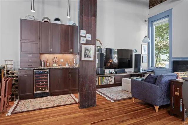 a kitchen with stainless steel appliances granite countertop a stove a sink dishwasher and a refrigerator