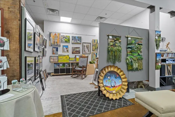 a living room with lots of furniture and wooden floor