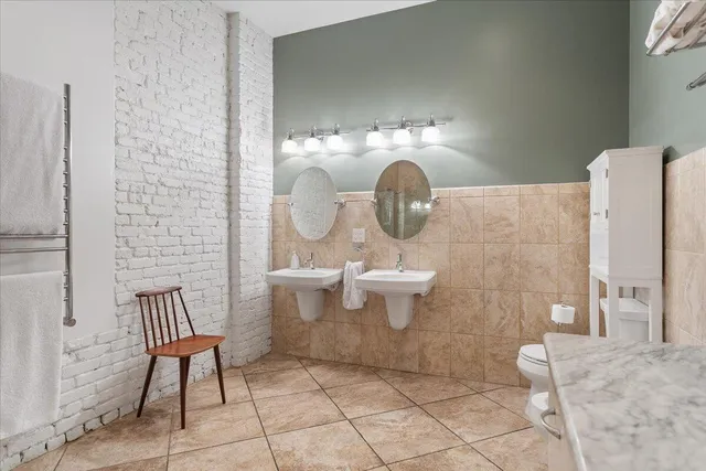 a bathroom with a shower and a glass door