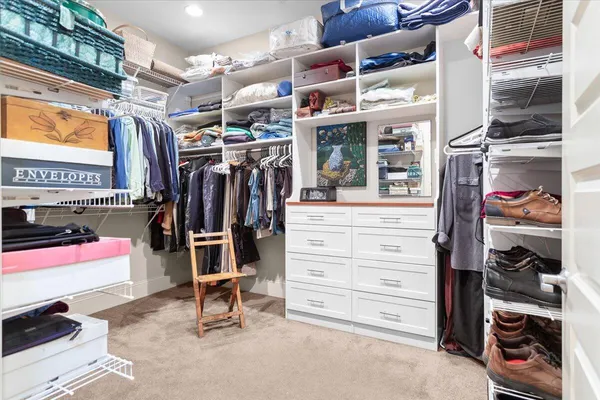 a view of a livingroom with furniture and a flat screen tv