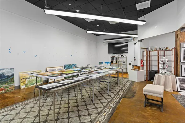 a kitchen with stainless steel appliances a stove top oven and a refrigerator