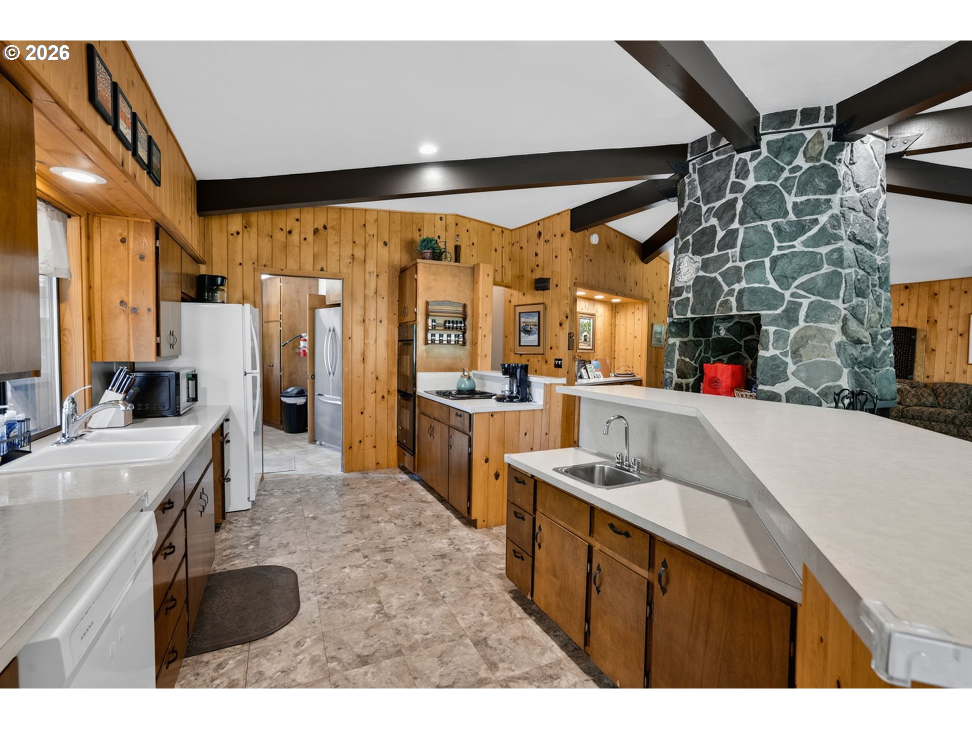 46725 Goodpasture Road Vida, OR 97488 - Photo 8 of 48 a kitchen with stainless steel appliances kitchen island granite countertop a sink and cabinets
