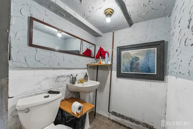 a bedroom with furniture and a large window