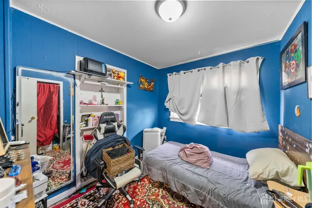 a large kitchen with a table and chairs