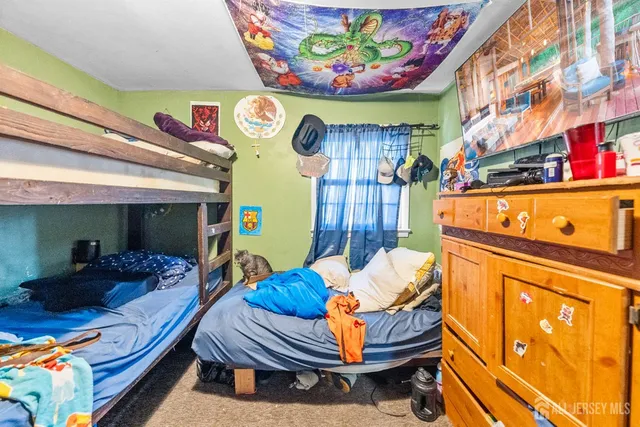 a view of a dining room with furniture and a chandelier