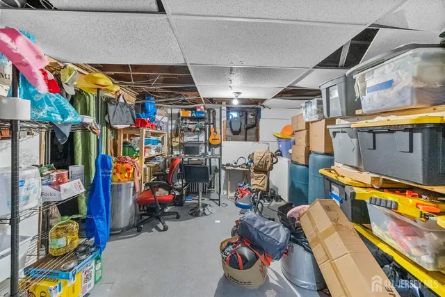 a view of a yard with a car parked in front of it