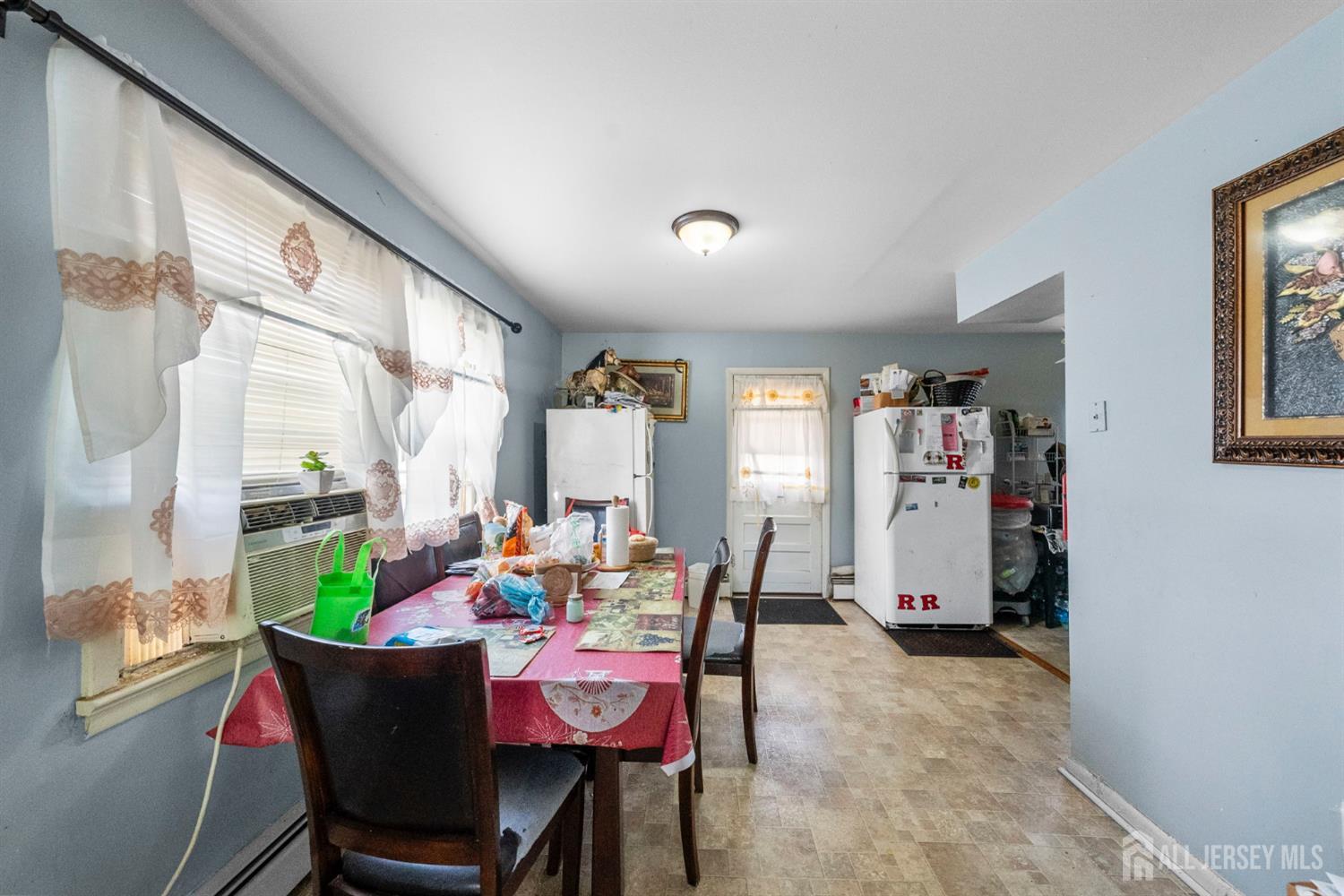 55 Frank Street Somerset, NJ 08873 - Photo 7 of 33 a dining room with furniture a rug and a large window