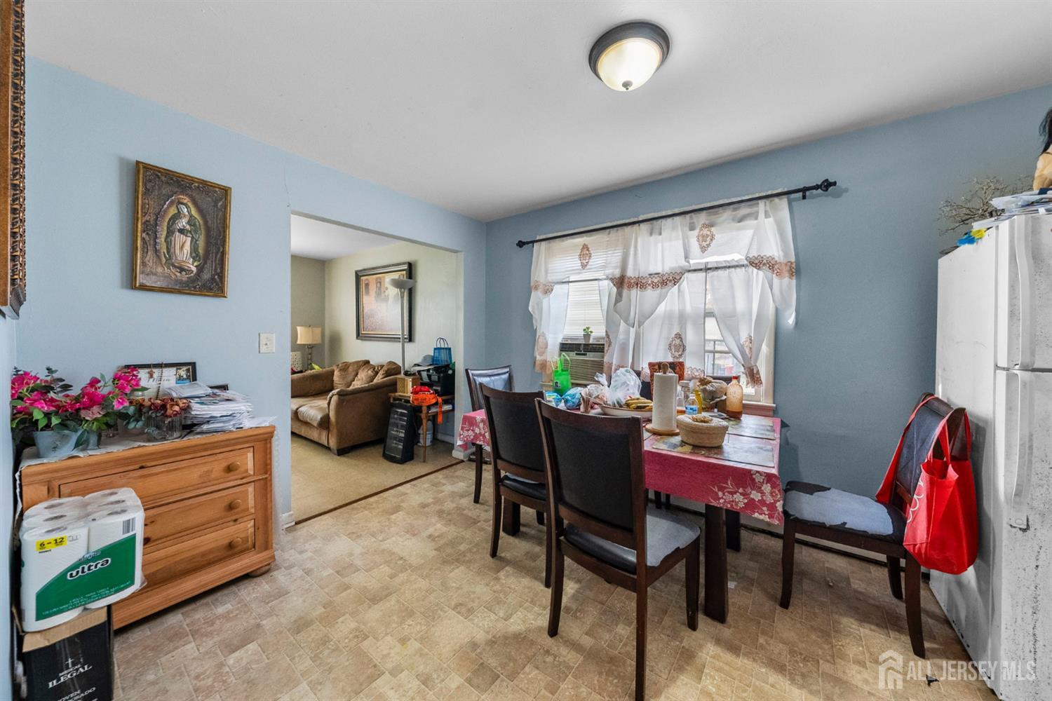 55 Frank Street Somerset, NJ 08873 - Photo 9 of 33 a living room with furniture gym equipment and a large window