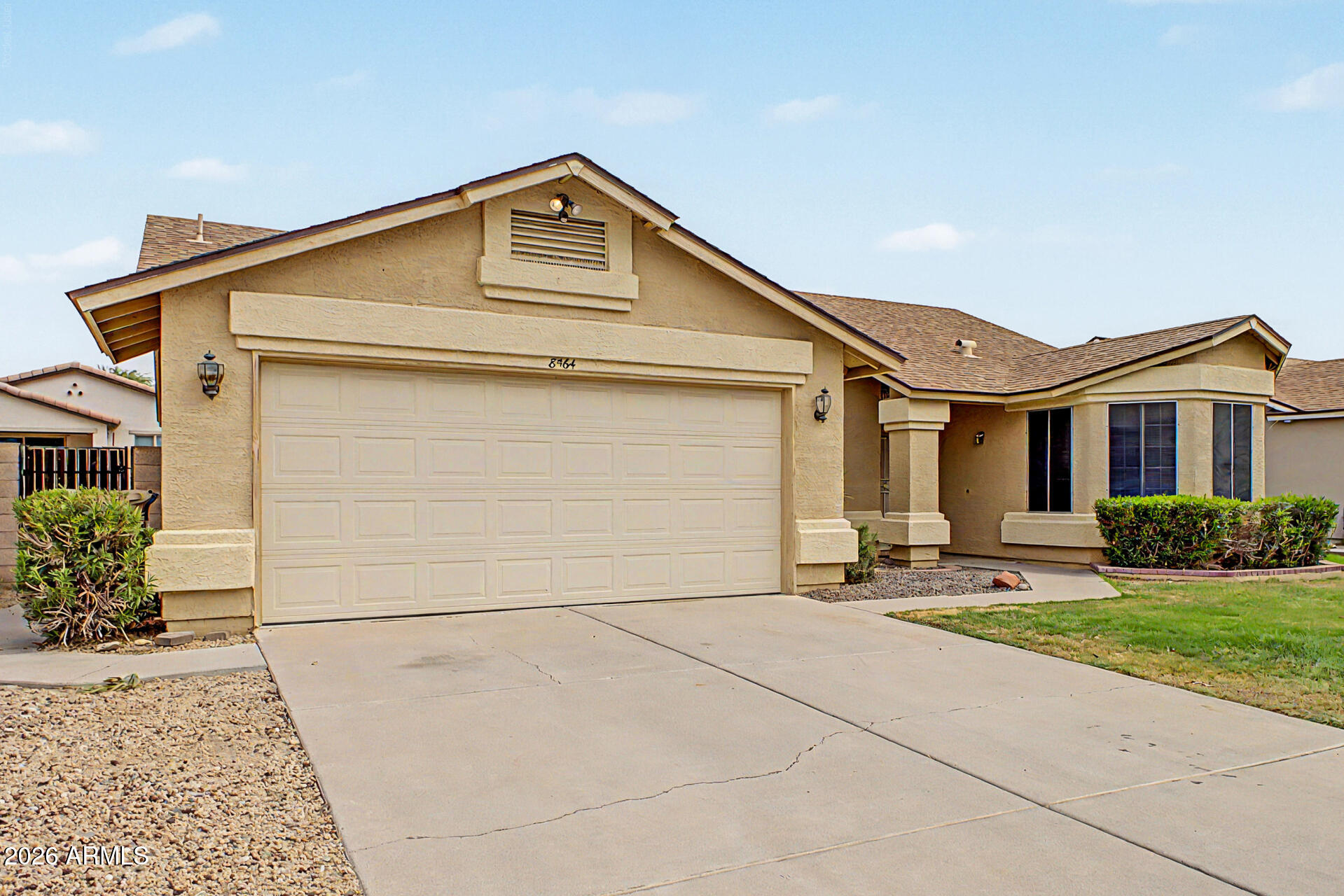 8564 West Ocotillo Road Glendale, AZ 85305 - Photo 4 of 34 a front view of a house with a yard