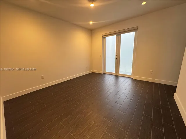 a bathroom with a tub sink and window