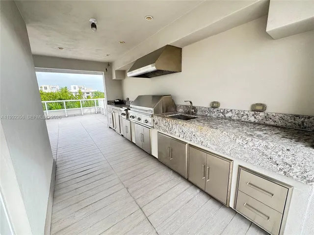 a view of kitchen with furniture and cabinets