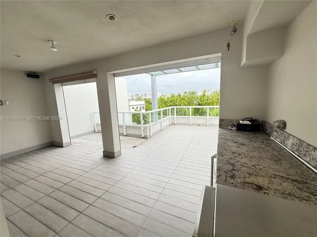 a kitchen with stainless steel appliances granite countertop a stove and a sink