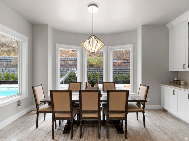 614 East High Lane Alpine, UT 84004 - Photo 38 of 75 Dining room featuring a chandelier and light wood-style floors