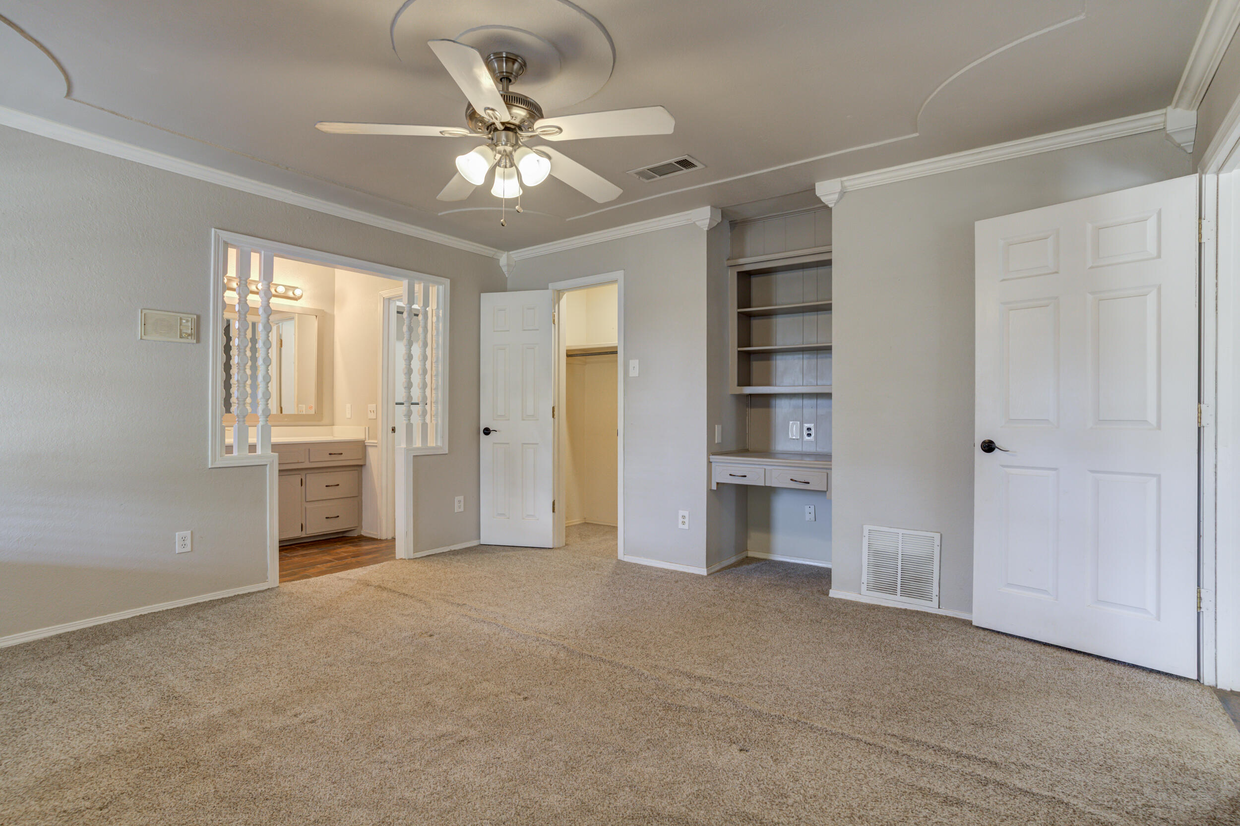 7106 Zoar Avenue Lubbock, TX 79424 - Photo 19 of 33 a view of an empty room with a fireplace and a window