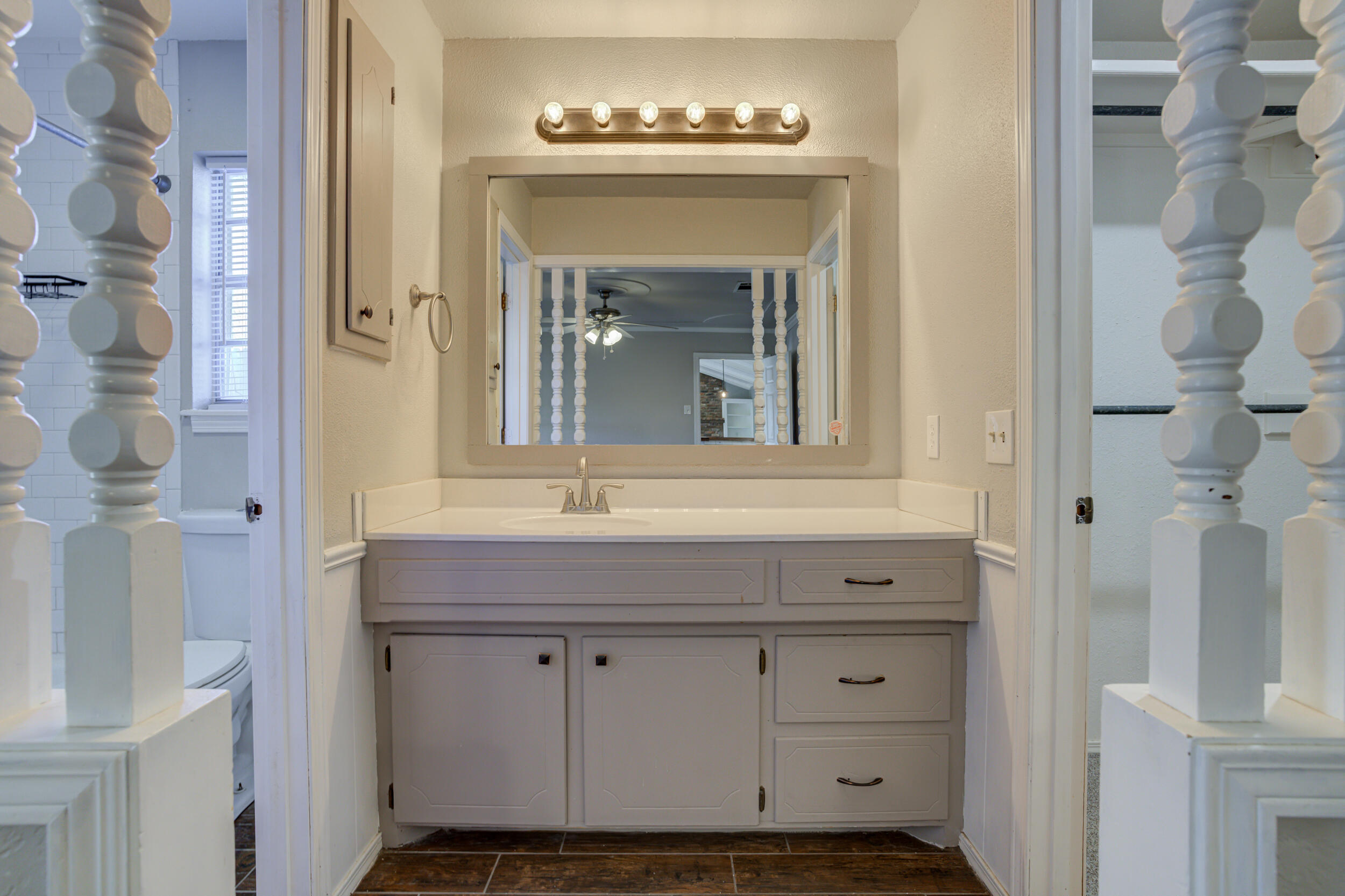 7106 Zoar Avenue Lubbock, TX 79424 - Photo 20 of 33 a bathroom with a sink and a mirror