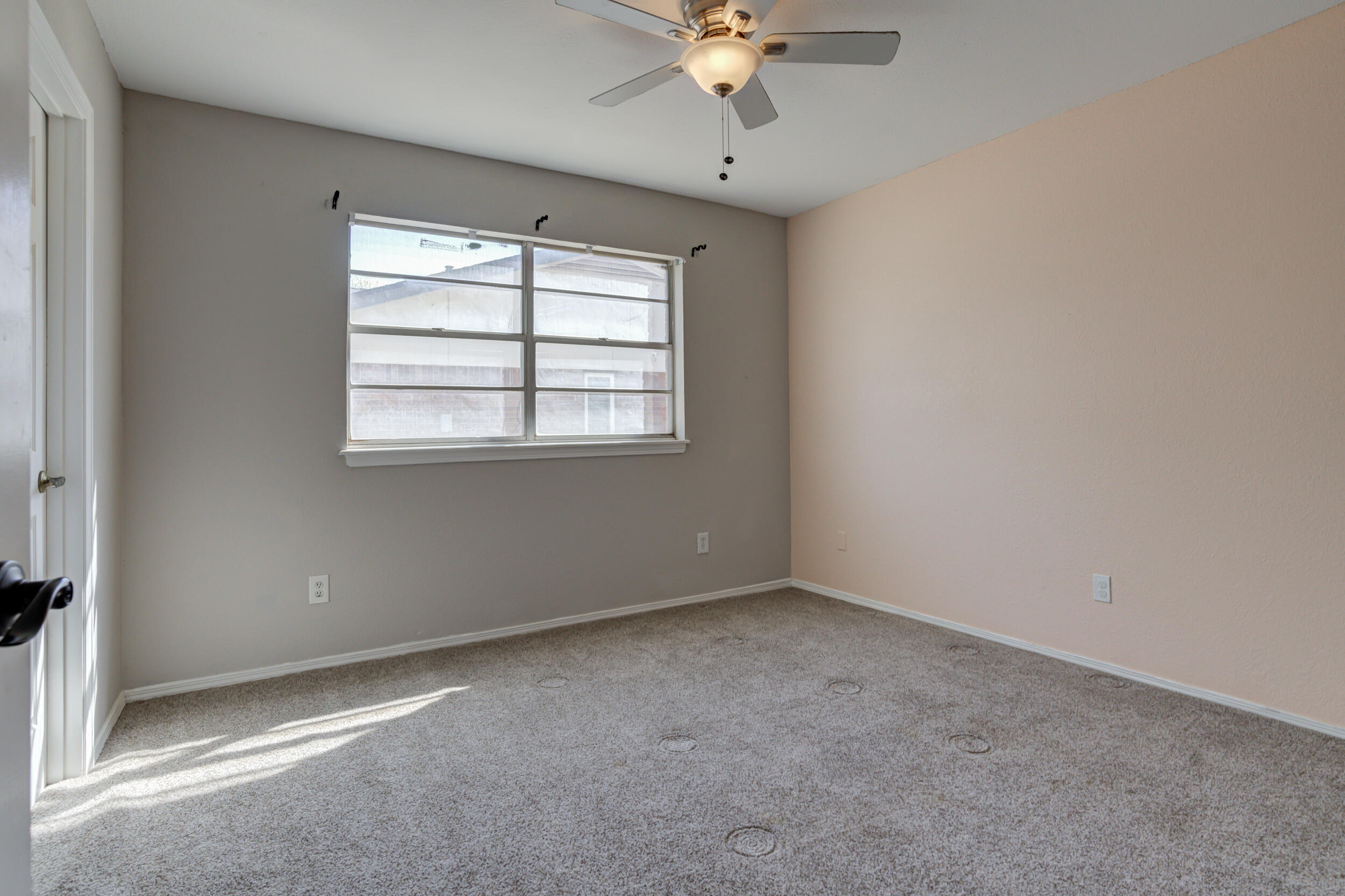 7106 Zoar Avenue Lubbock, TX 79424 - Photo 25 of 33 an empty room with a window
